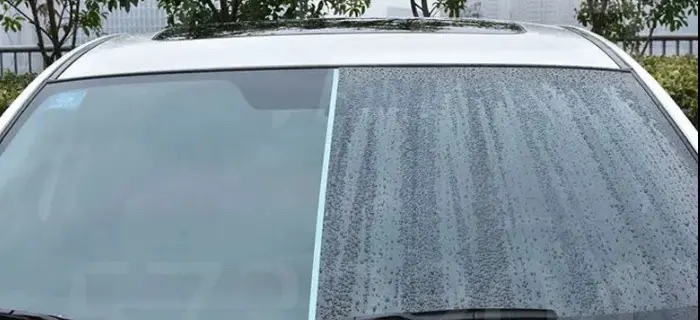 Windshield comparison showing water beading on a ceramic coated surface versus an uncoated one
