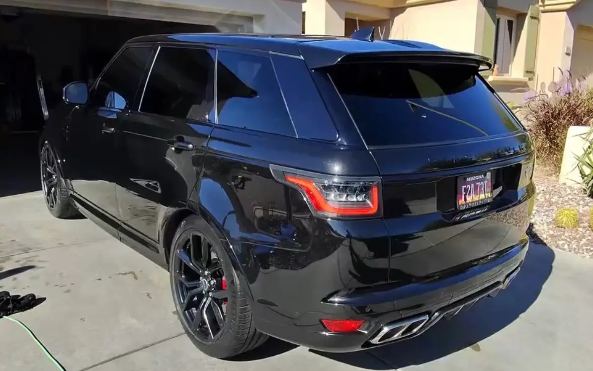 Glossy machine-polished paint on black Range Rover